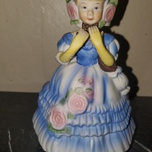 Music box figurine. Girl in blue.